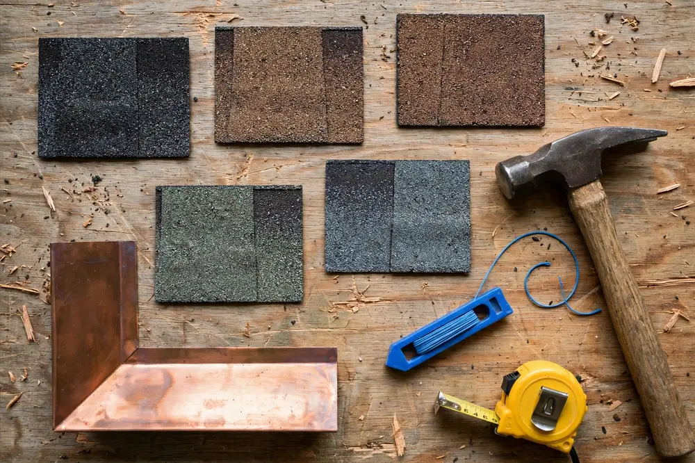 Shingle samples and roofing tools on a workbench at Colorado Hail Roof Pros